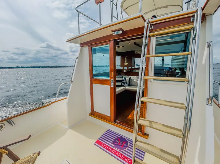 Mystic Yacht Photos Pics 1989 Grand Banks 36 Sedan yacht deck with ladder and ocean view.