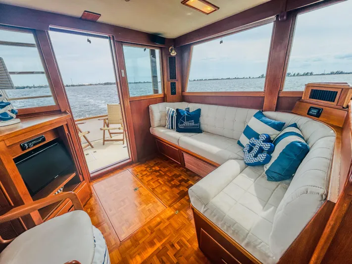 Mystic Yacht Photos Pics Interior of 1989 Grand Banks 36 Sedan with cozy seating and ocean view.