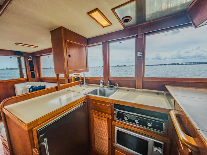 Mystic Yacht Photos Pics Interior of 1989 Grand Banks 36 Sedan yacht with kitchen and ocean view.