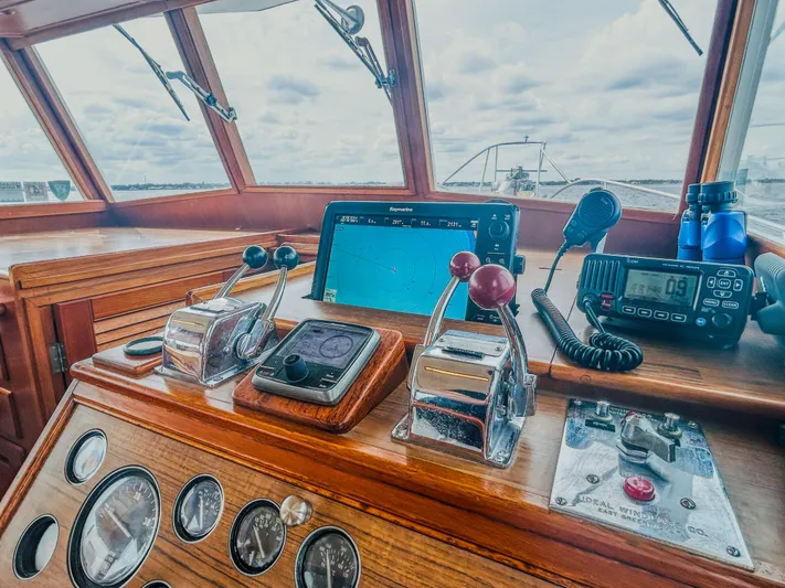 Mystic Yacht Photos Pics Helm of 1989 Grand Banks 36 Sedan with navigation equipment and controls.