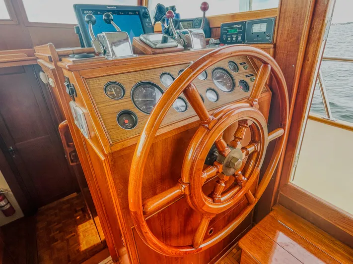 Mystic Yacht Photos Pics Wooden helm of 1989 Grand Banks 36 Sedan with gauges and controls.