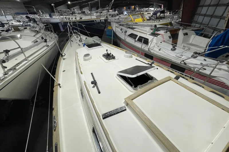 Felicity Yacht Photos Pics 1997 Pacific Seacraft 34 sailboat in storage, surrounded by other boats.