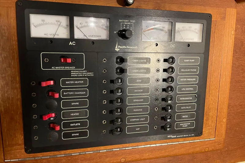 Felicity Yacht Photos Pics Electrical control panel of a 1997 Pacific Seacraft 34 sailboat with AC and DC switches.