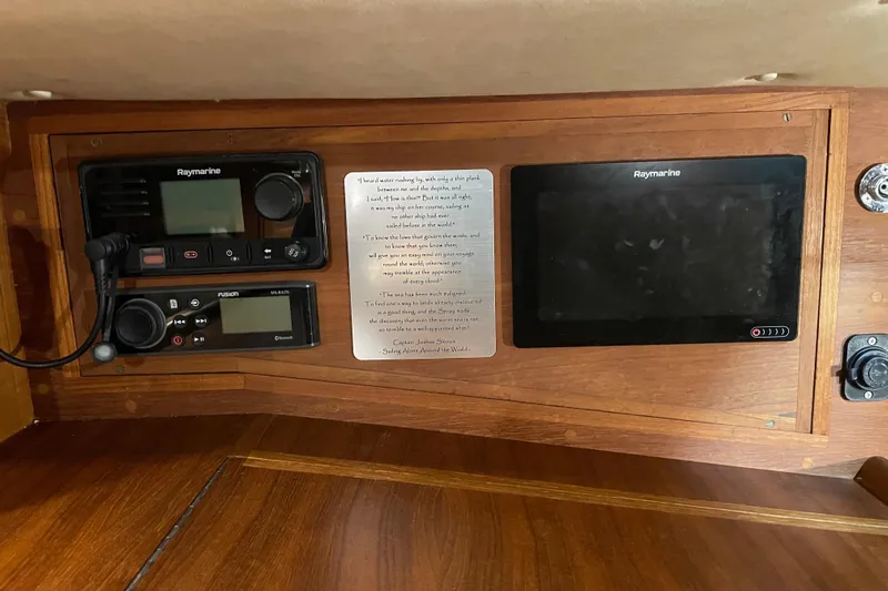 Felicity Yacht Photos Pics Navigation equipment on a 1997 Pacific Seacraft 34 sailboat, featuring Raymarine and Fusion systems.