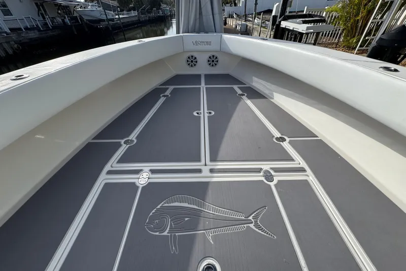  Yacht Photos Pics 2009 Venture 39 Center Console boat deck with fish design and sleek finish.