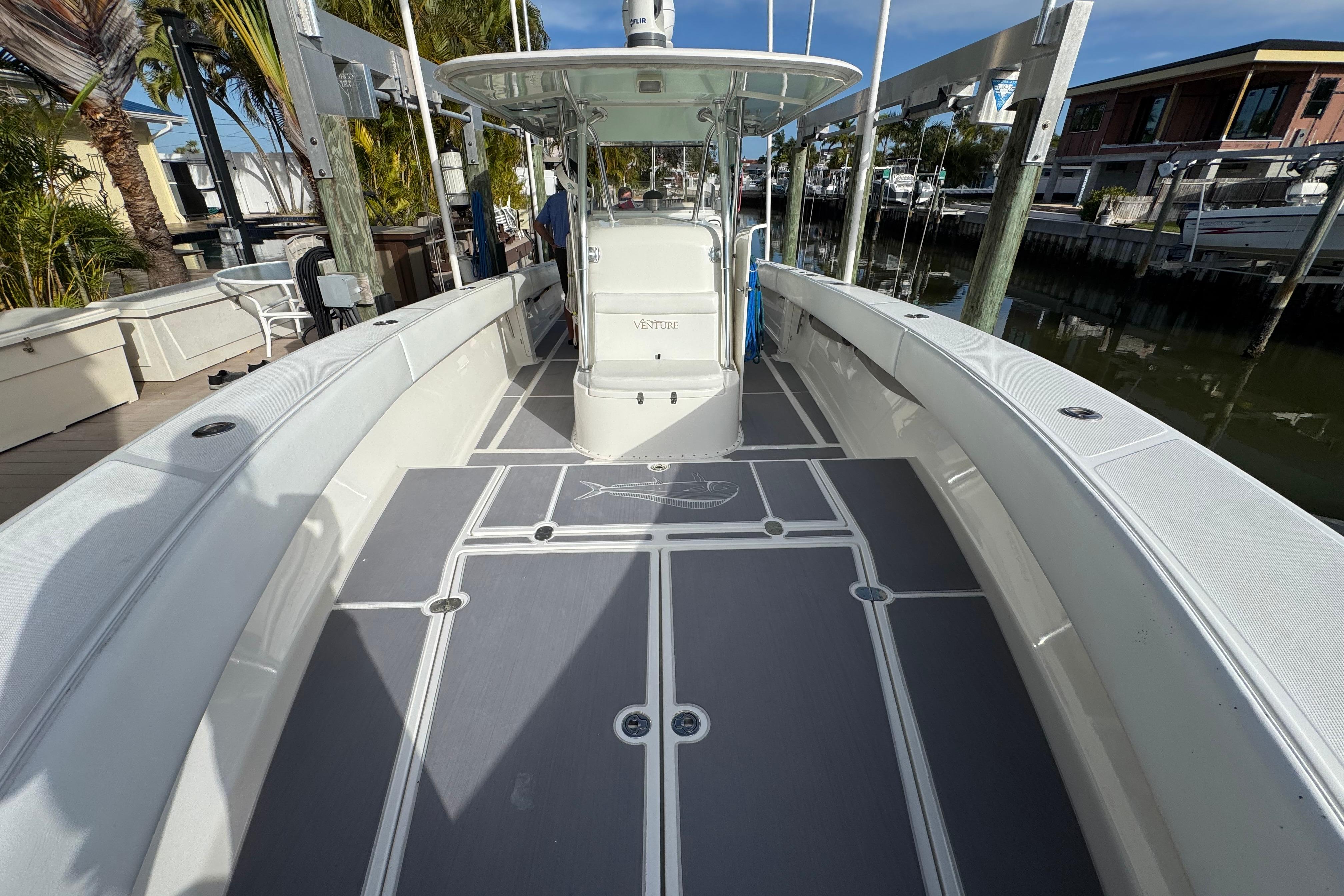2009 Venture 39 Center Console boat docked, featuring spacious deck and sleek design.