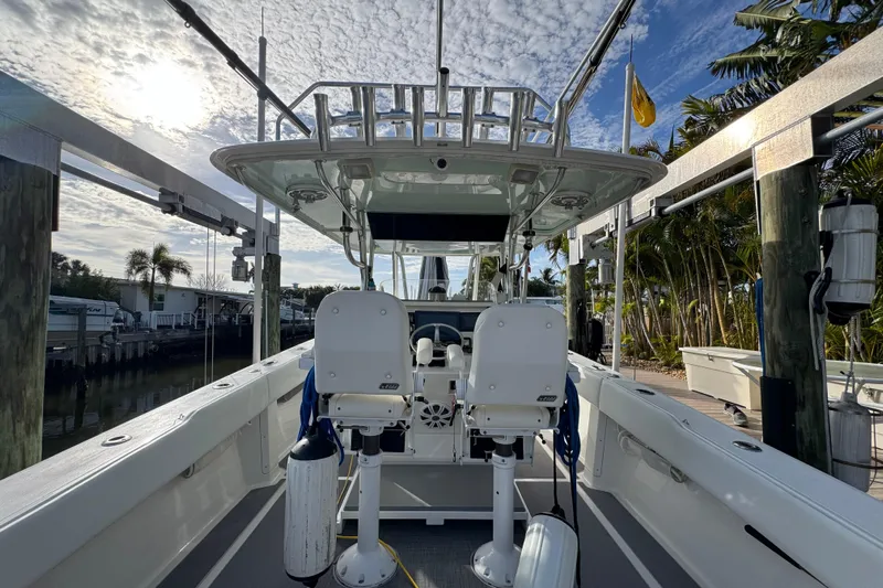  Yacht Photos Pics 2009 Venture 39 Center Console boat docked, featuring dual seats and a clear sky backdrop.