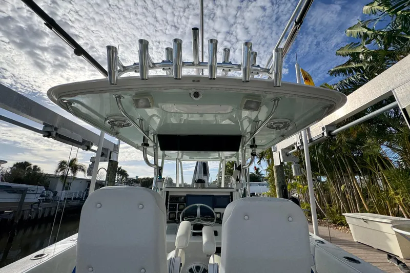  Yacht Photos Pics 2009 Venture 39 Center Console boat with dual seats and rod holders, docked under a cloudy sky.