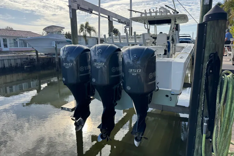  Yacht Photos Pics 2009 Venture 39 Center Console with triple Yamaha 350 V8 engines docked by waterfront.