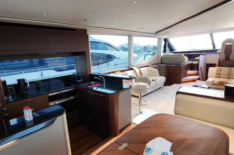  Yacht Photos Pics Luxurious interior of 2025 Princess Y72 Motor Yacht with modern kitchen and seating area.