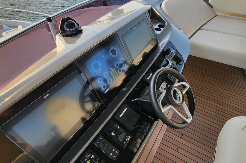  Yacht Photos Pics Helm of 2025 Princess Y72 Motor Yacht with advanced navigation controls and luxurious seating.