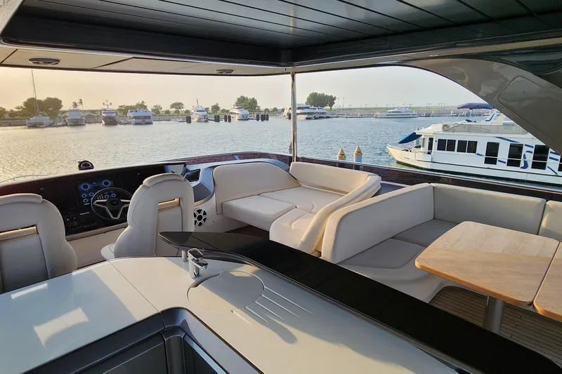  Yacht Photos Pics Luxurious 2025 Princess Y72 Motor Yacht interior with elegant seating and scenic marina view.