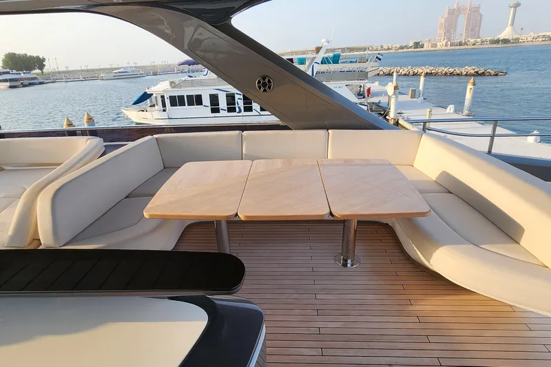 Yacht Photos Pics Luxurious seating area on 2025 Princess Y72 Motor Yacht, docked with scenic waterfront view.