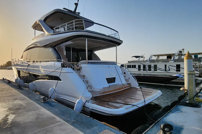  Yacht Photos Pics 2025 Princess Y72 Motor Yacht docked at marina during sunset.