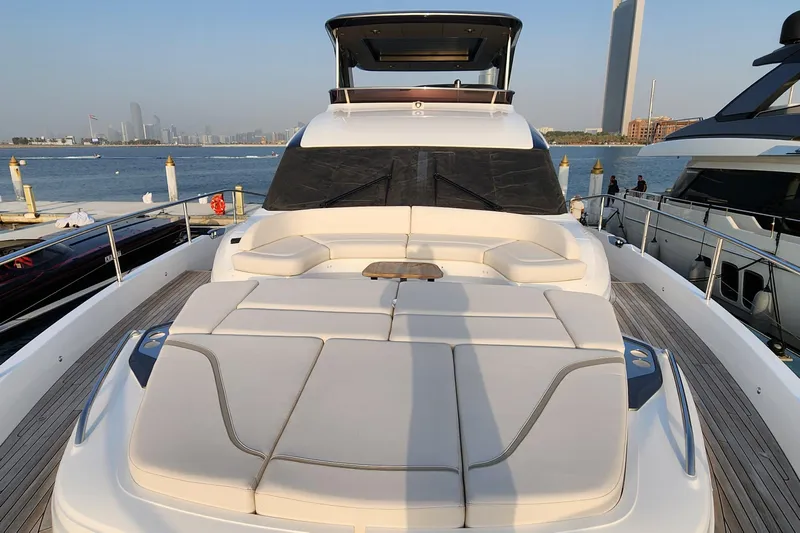  Yacht Photos Pics Luxurious 2025 Princess Y72 Motor Yacht docked with spacious sunbathing area.