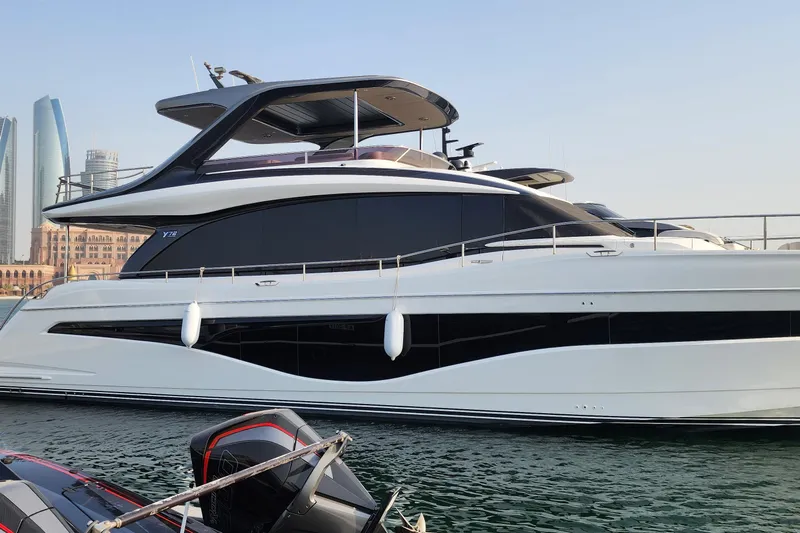 Yacht Photos Pics Luxurious 2025 Princess Y72 Motor Yacht docked in a scenic marina setting.
