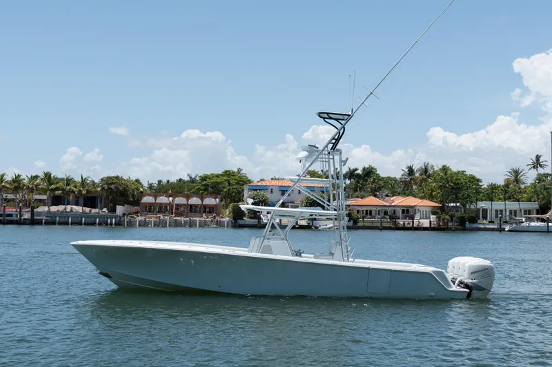  Yacht Photos Pics 2017 SeaVee 390Z boat on water, with coastal homes in the background.