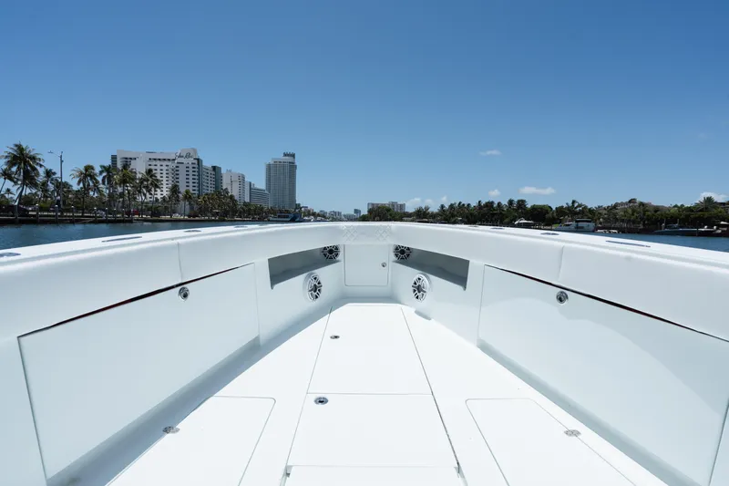  Yacht Photos Pics 2017 SeaVee 390Z boat deck with city skyline and palm trees in the background.