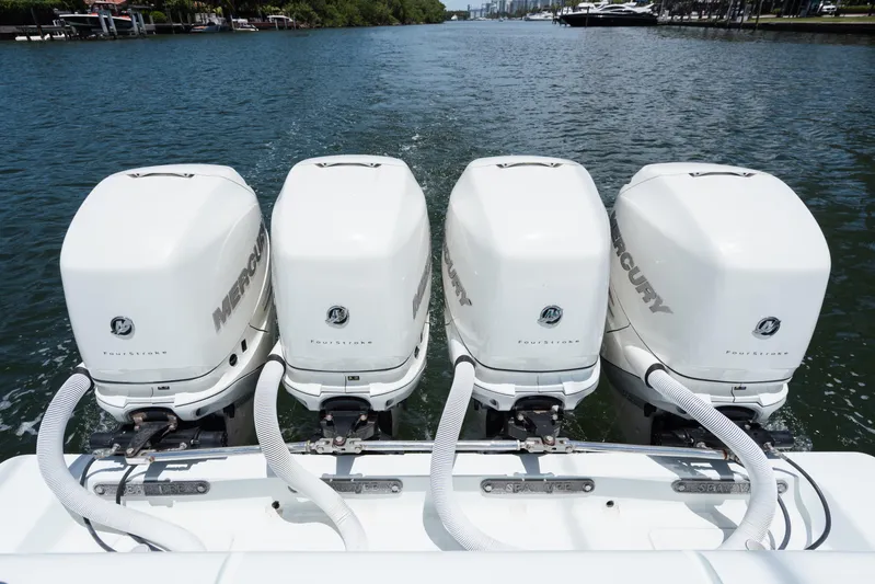  Yacht Photos Pics Four Mercury outboard engines on a 2017 SeaVee 390Z boat, cruising on a waterway.