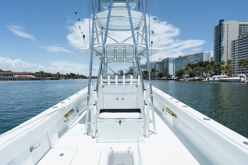  Yacht Photos Pics 2017 SeaVee 390Z boat on water, city skyline in background, clear blue sky.