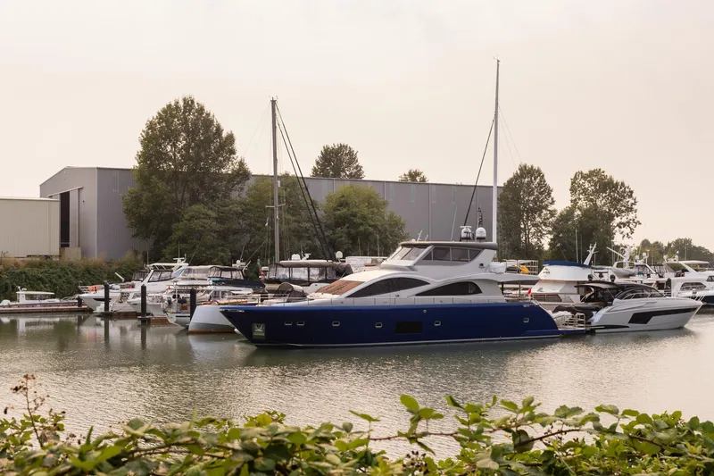  Yacht Photos Pics Luxury Primorets Custom yacht docked at marina, surrounded by trees and other boats.