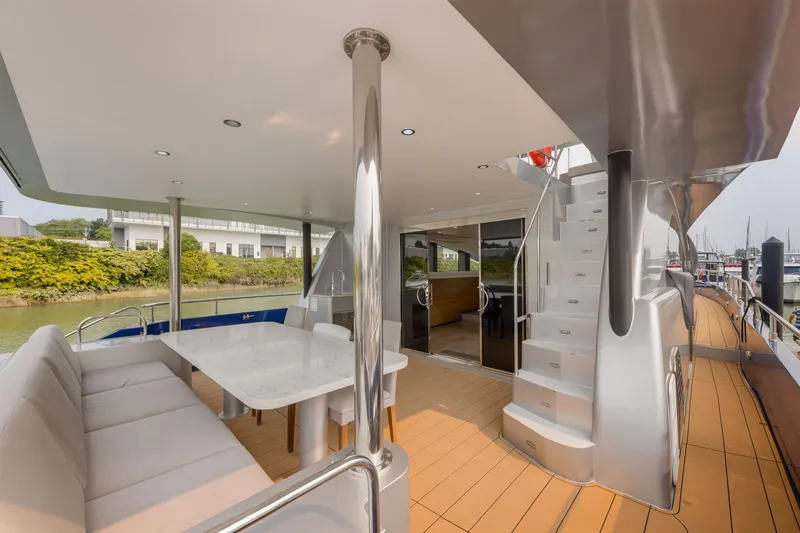  Yacht Photos Pics Luxurious 2010 Primorets Custom yacht deck with seating, table, and staircase.