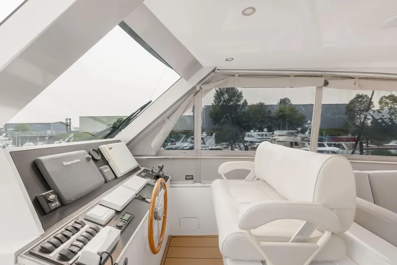  Yacht Photos Pics Interior of 2010 Primorets Custom yacht with modern navigation equipment and white seating.