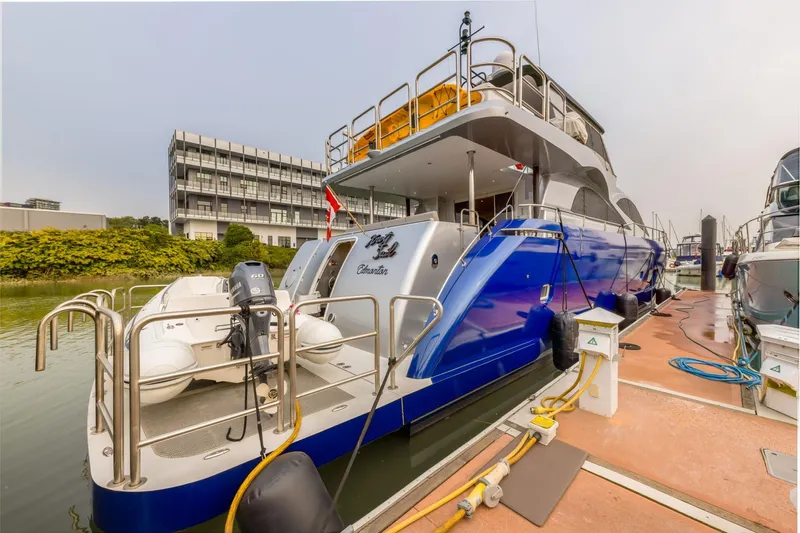  Yacht Photos Pics Luxury Primorets Custom 2010 yacht docked at marina with inflatable boat attached.