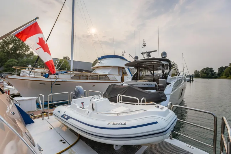  Yacht Photos Pics Luxury yacht docked with Canadian flag, featuring a Primorets Custom model, 2010.