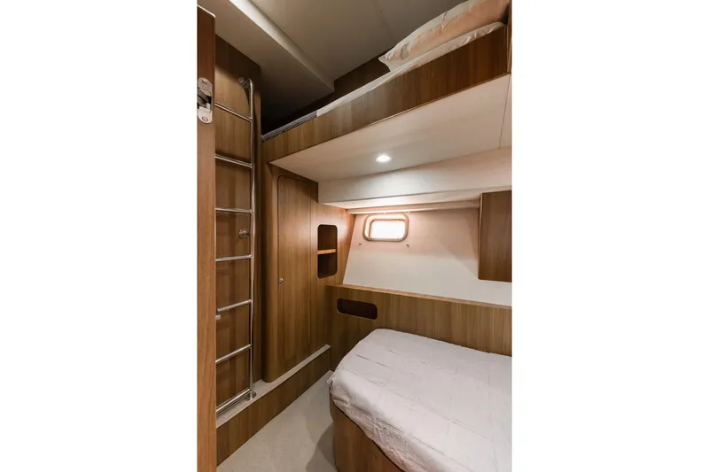  Yacht Photos Pics Cozy cabin interior with wooden bunk beds and ladder, Primorets Custom 2010 model.