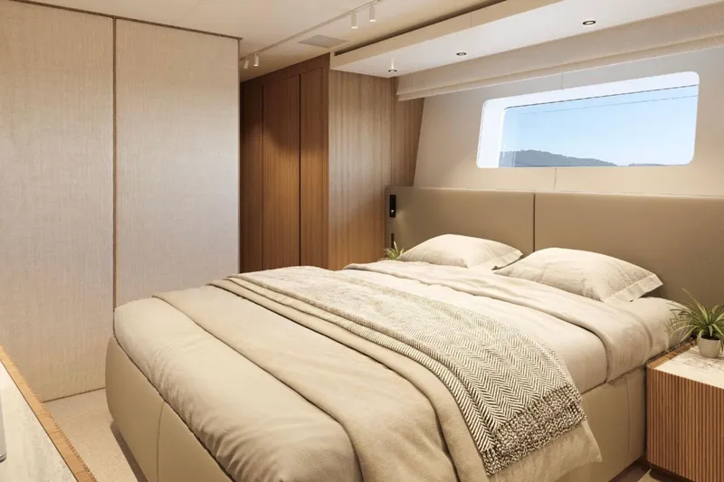  Yacht Photos Pics Luxurious bedroom interior of 2025 Sanlorenzo SD90 yacht with modern design and large window.