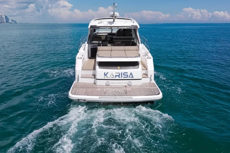 Karisa Yacht Photos Pics 2018 Fairline Targa 53 OPEN yacht cruising on open sea, rear view.
