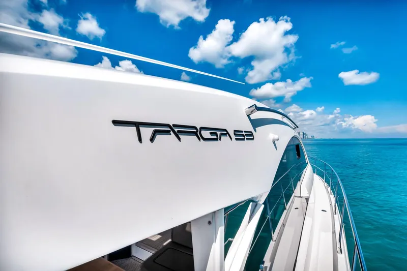 Karisa Yacht Photos Pics 2018 Fairline Targa 53 OPEN yacht cruising on a sunny day with blue skies.