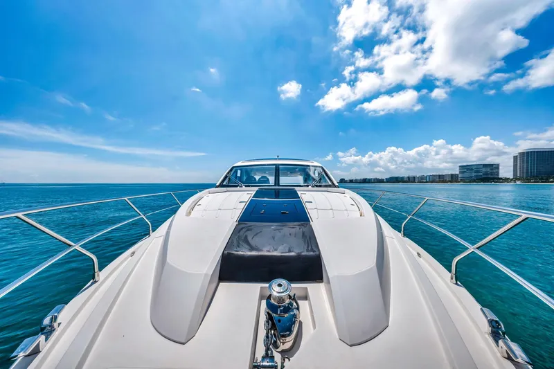 Karisa Yacht Photos Pics 2018 Fairline Targa 53 OPEN yacht cruising on clear blue waters under a sunny sky.