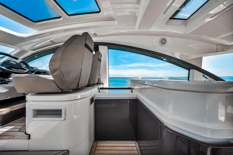 Karisa Yacht Photos Pics Interior of 2018 Fairline Targa 53 OPEN yacht with ocean view through large windows.