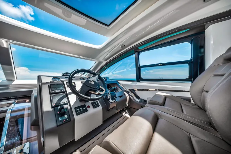 Karisa Yacht Photos Pics Interior of 2018 Fairline Targa 53 OPEN yacht, featuring modern helm and luxurious seating.