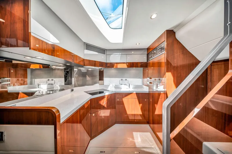 Karisa Yacht Photos Pics Luxurious kitchen interior of 2018 Fairline Targa 53 OPEN yacht with wood finish.