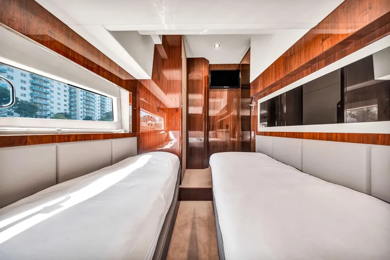 Karisa Yacht Photos Pics Luxurious interior of 2018 Fairline Targa 53 OPEN yacht with twin beds and wood paneling.