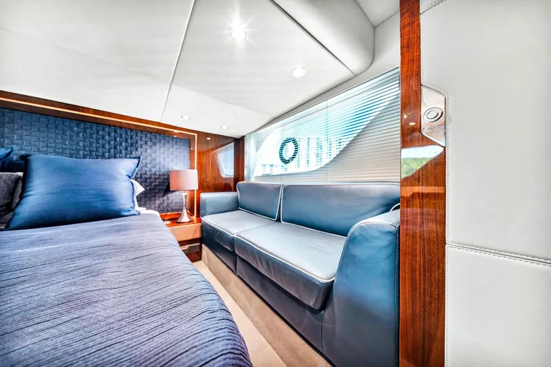 Karisa Yacht Photos Pics Luxurious interior of 2018 Fairline Targa 53 OPEN yacht with blue seating and elegant decor.