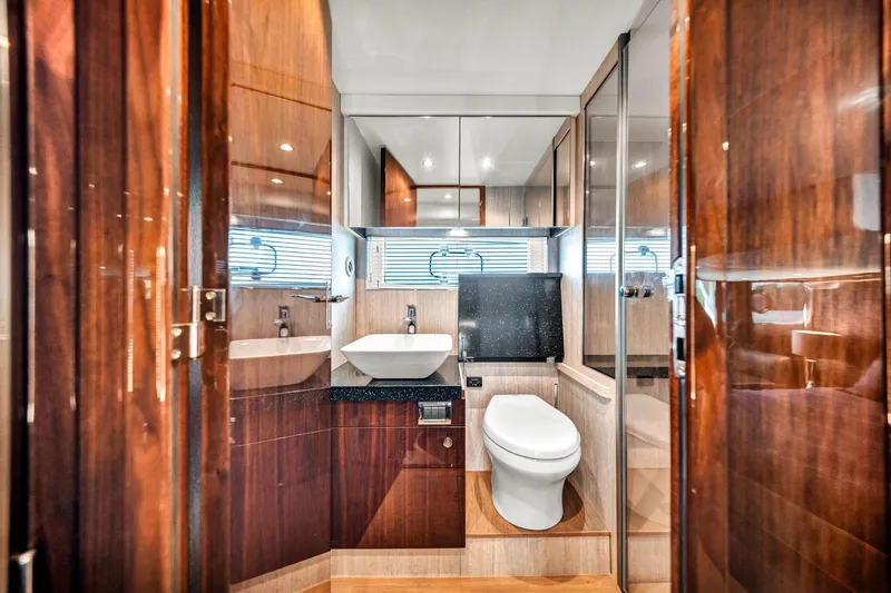 Karisa Yacht Photos Pics Luxurious bathroom interior of 2018 Fairline Targa 53 OPEN yacht, featuring modern fixtures and wood finishes.