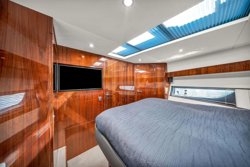 Karisa Yacht Photos Pics Luxurious cabin interior of 2018 Fairline Targa 53 OPEN yacht with wood paneling.