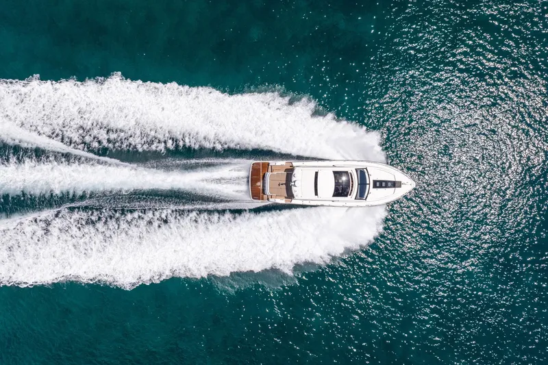 Karisa Yacht Photos Pics Aerial view of 2018 Fairline Targa 53 OPEN yacht cruising on blue ocean waters.