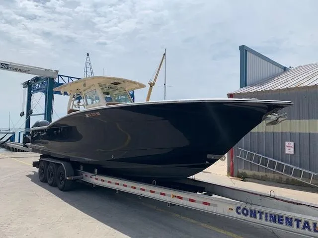  Yacht Photos Pics 2016 Scout 350 LXF boat on trailer at marina, ready for launch.
