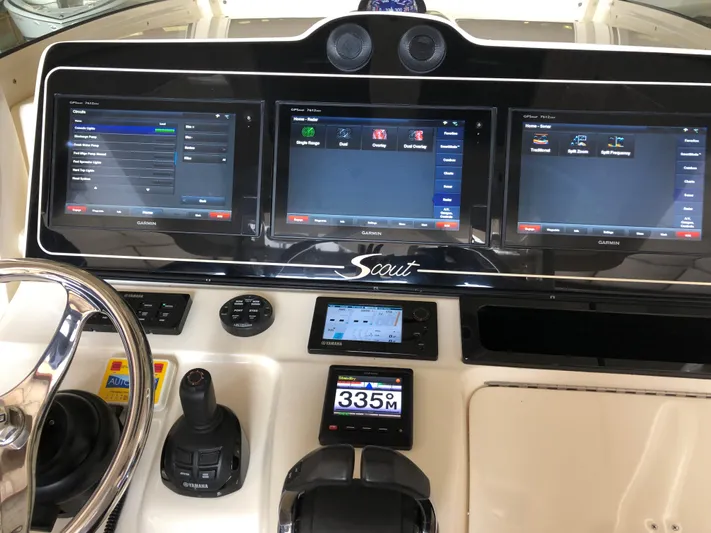 Yacht Photos Pics 2016 Scout 350 LXF boat dashboard with advanced navigation screens and controls.