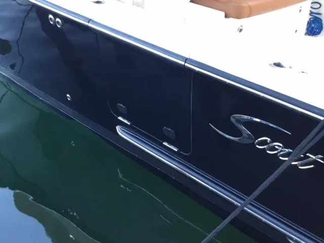  Yacht Photos Pics 2016 Scout 350 LXF boat side view with logo, docked on calm water.