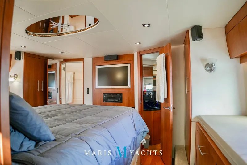  Yacht Photos Pics Luxurious interior of 2009 Regal 52 Sport Coupe yacht bedroom with modern amenities.