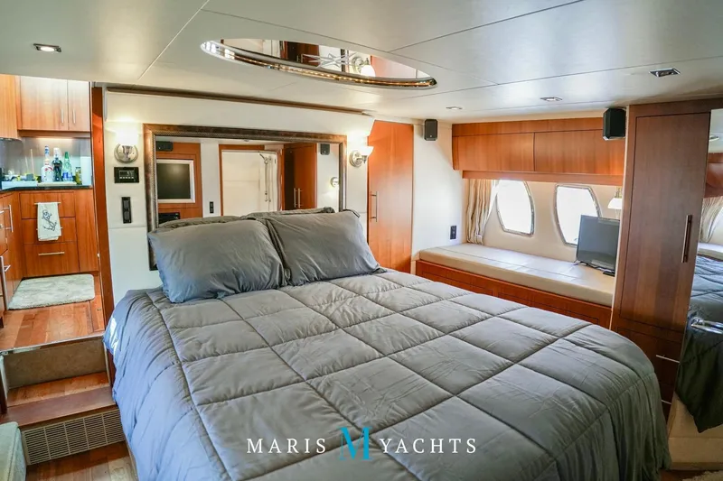  Yacht Photos Pics Luxurious bedroom interior of 2009 Regal 52 Sport Coupe yacht with modern amenities.