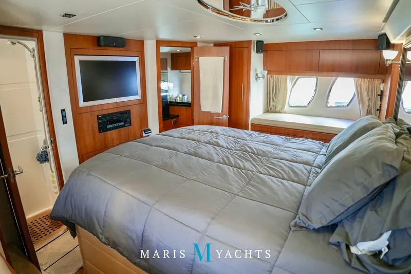  Yacht Photos Pics Luxurious cabin interior of 2009 Regal 52 Sport Coupe yacht with modern amenities.