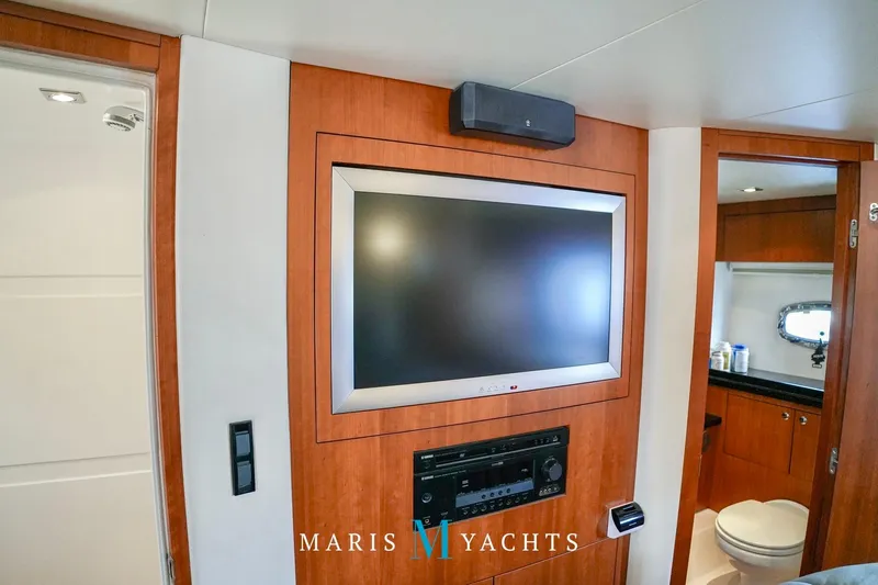  Yacht Photos Pics Interior of 2009 Regal 52 Sport Coupe yacht with TV and bathroom.