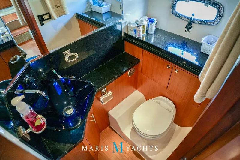  Yacht Photos Pics Luxurious bathroom in 2009 Regal 52 Sport Coupe yacht with modern fixtures.